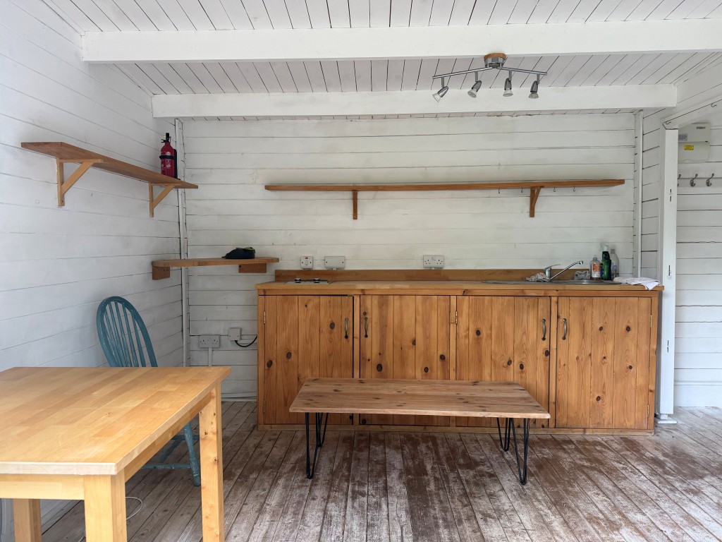 Lot: 138 - TIMBER CHALET WITH RESIDENTIAL USE, GRANITE CARTHOUSE WITH PLANNING IN PRINCIPLE, PLUS GARDENS AND PARKING - Chalet kitchen living area